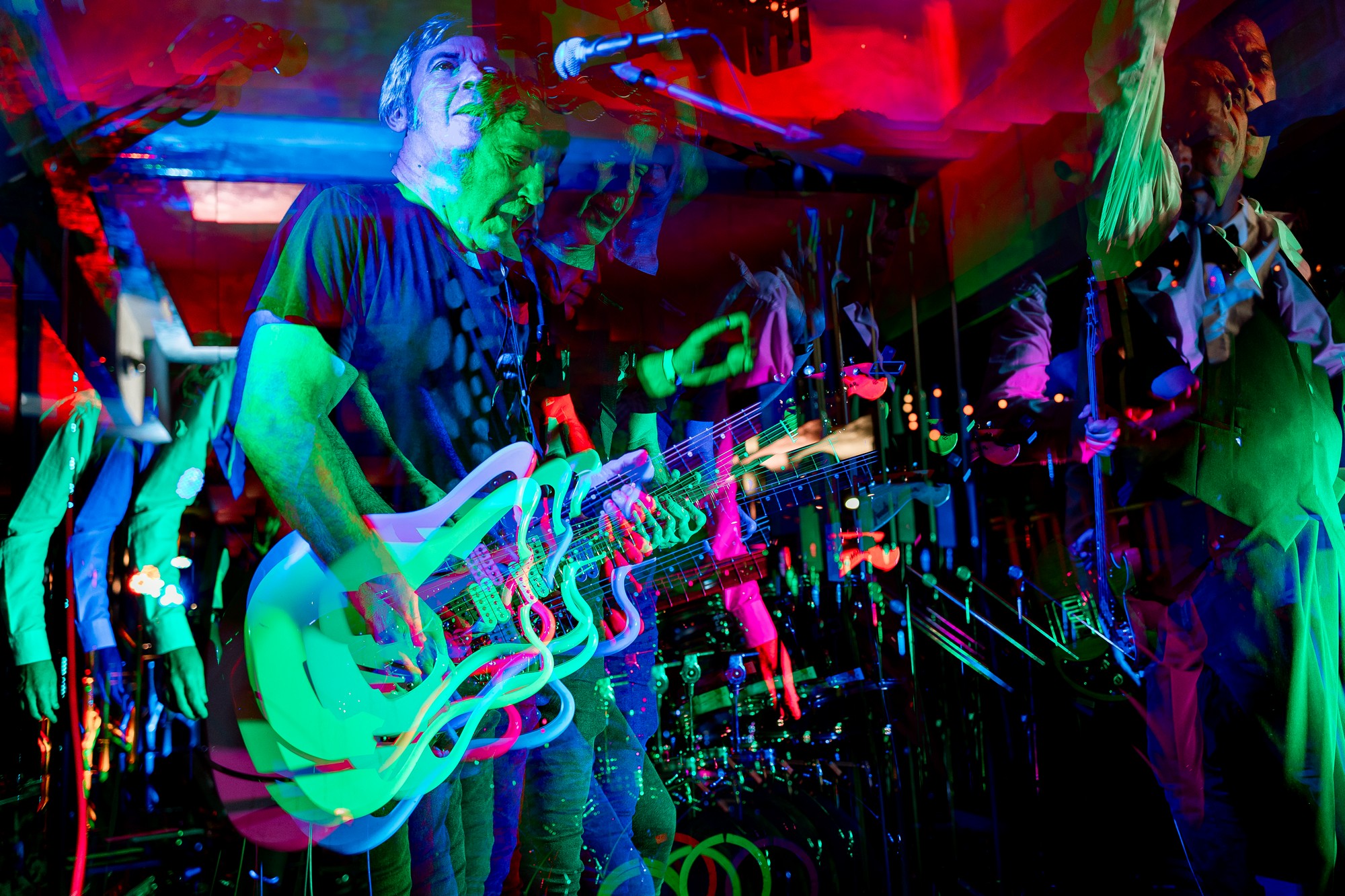 Backstage view of massive concert arena in red light